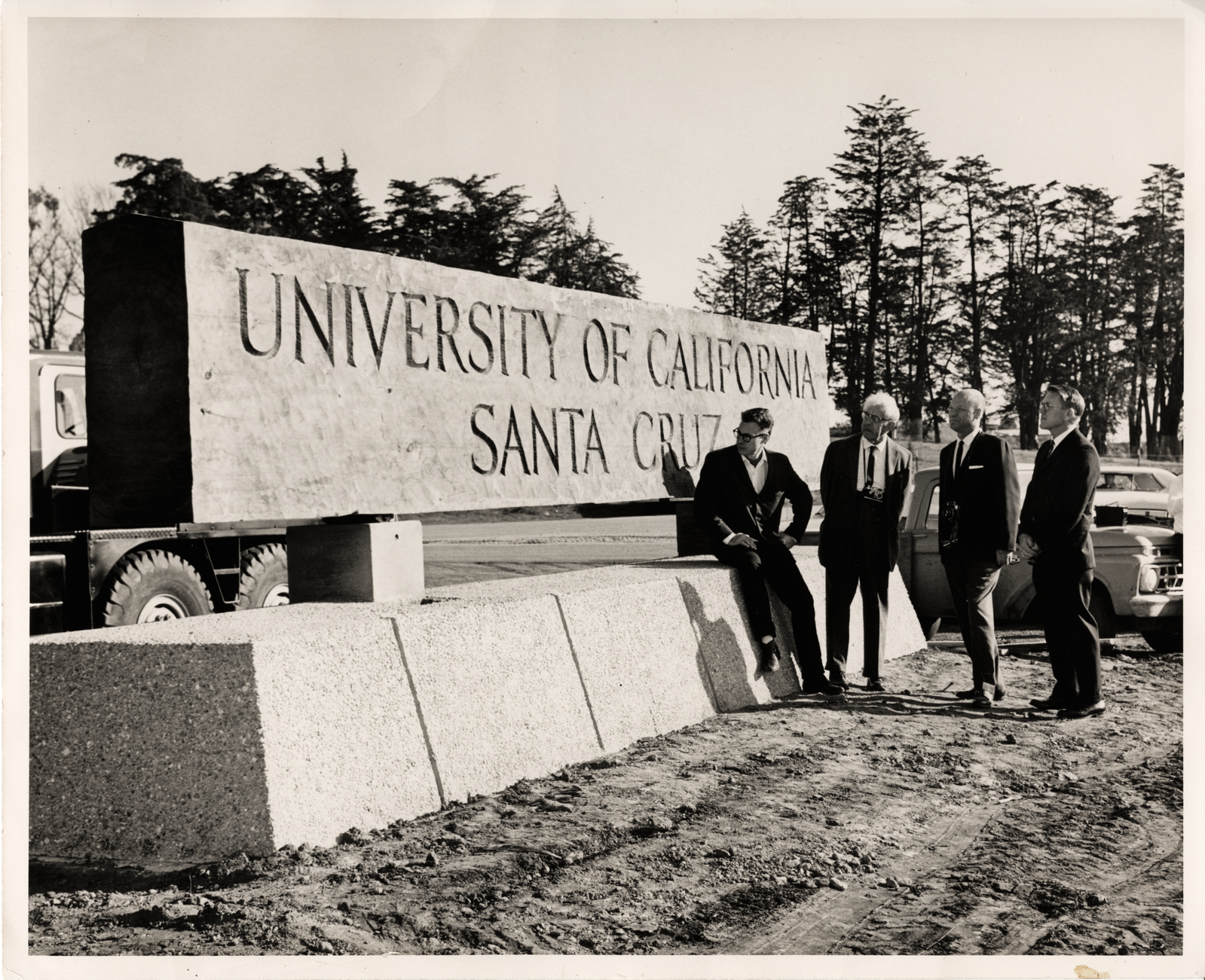 Founders looking at UCSC sign in 1965